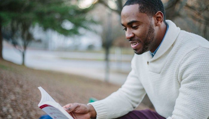happy man reading book mindfulness